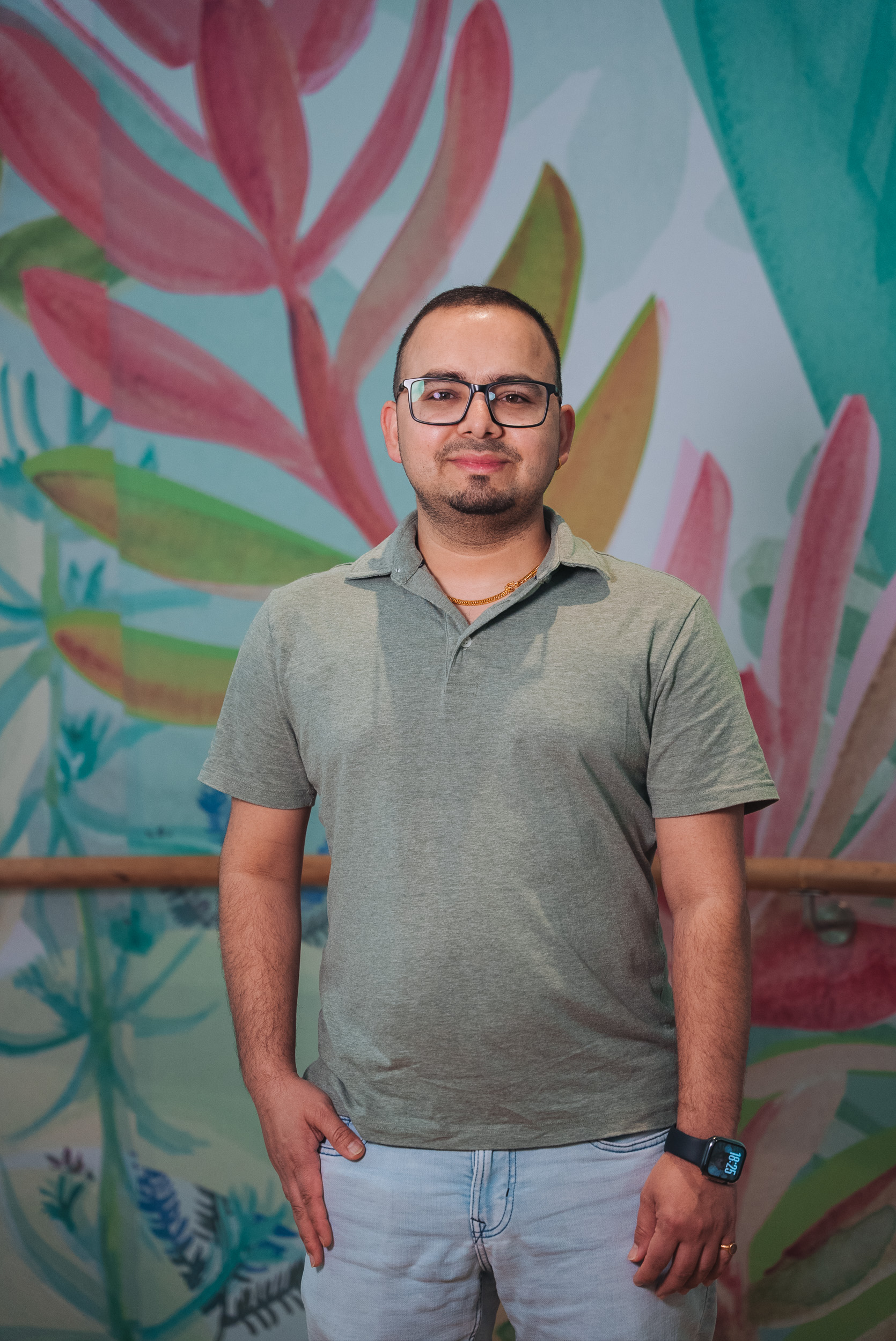 A person wearing a light green t-shirt A person wearing a light green t-shirt