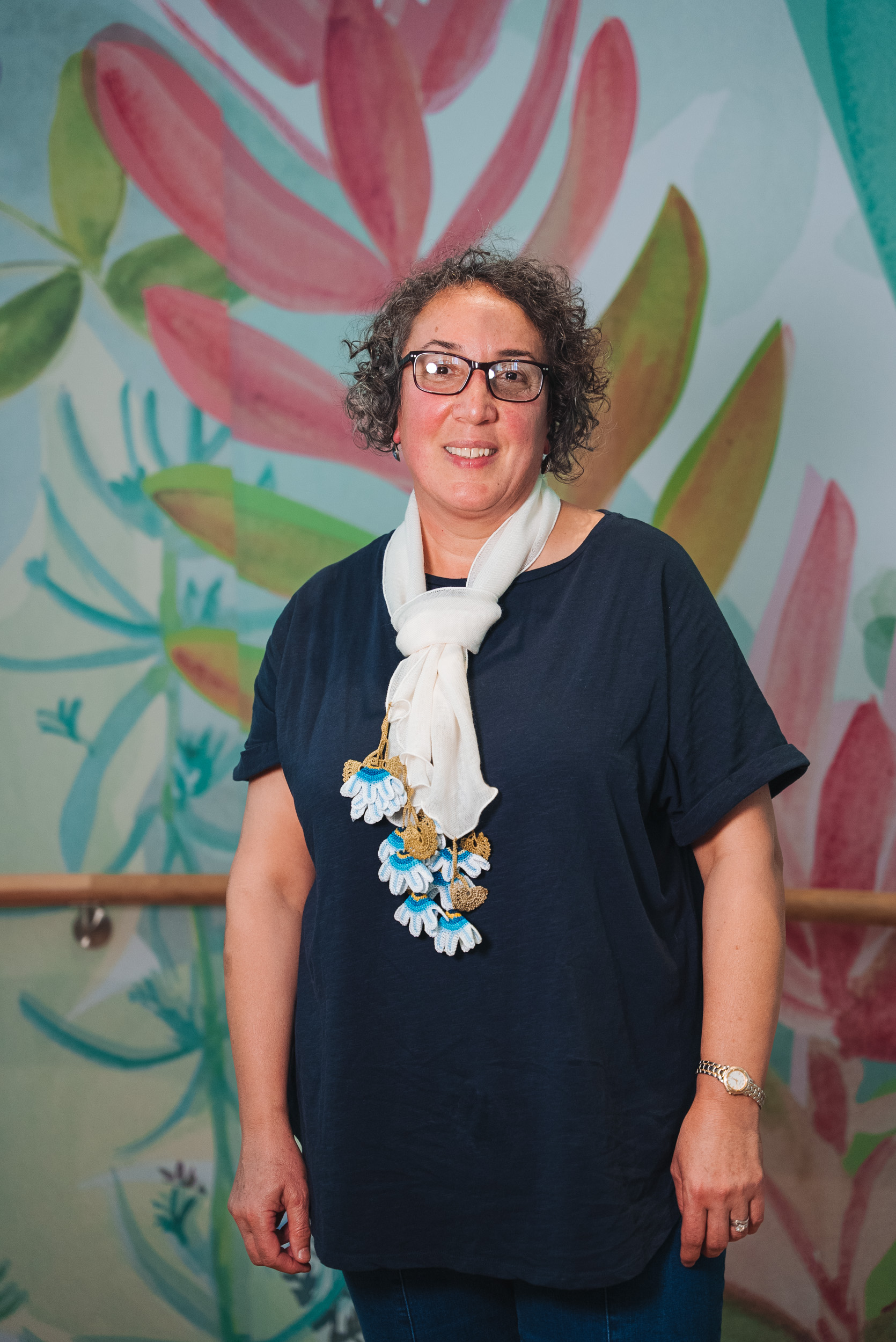 A person wearing a white scarf A person wearing a white scarf