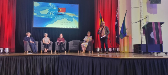 # panel members and Kirsty sitting on chairs on Town Hall stage with Jose standing to the right # panel members and Kirsty sitting on chairs on Town Hall stage with Jose standing to the right