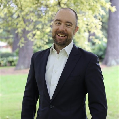 A man wearing a suit A man wearing a suit